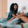 friends laughing together on a couch