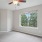 bedroom with carpet and window