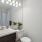 bathroom with sink mirror and toilet 