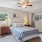bedroom with bed lamps and windows