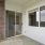 balcony with glass doors mirrors and guard railing