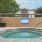 a hot tub outside with a sign